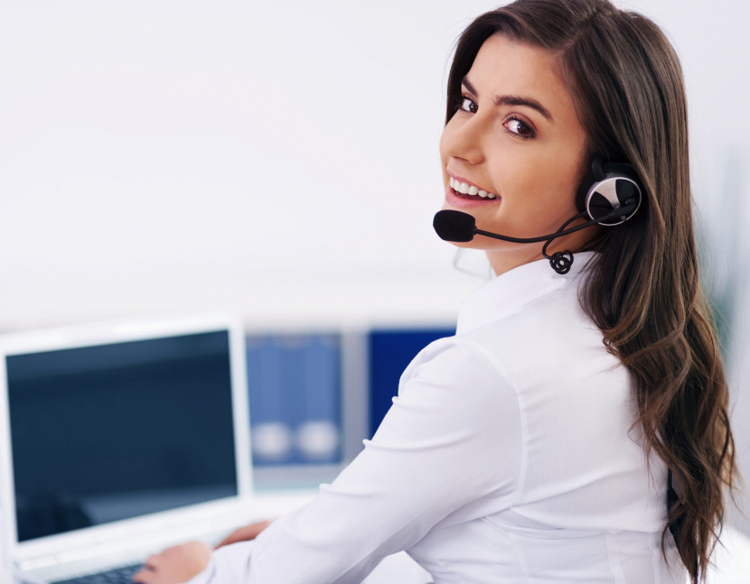 Young female operator with headphones